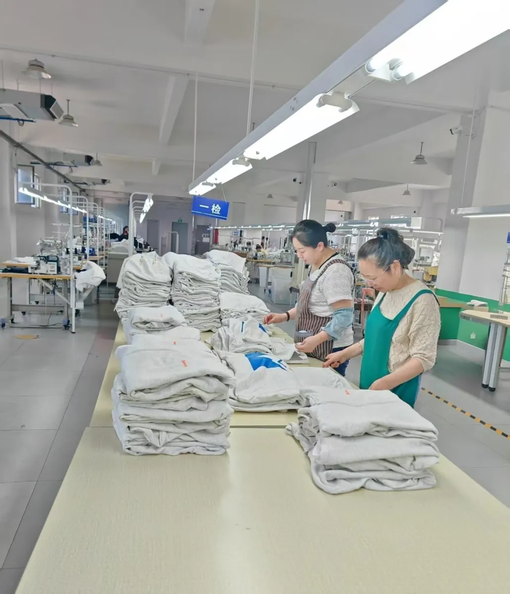 Final quality inspection of garments before packing at our factory