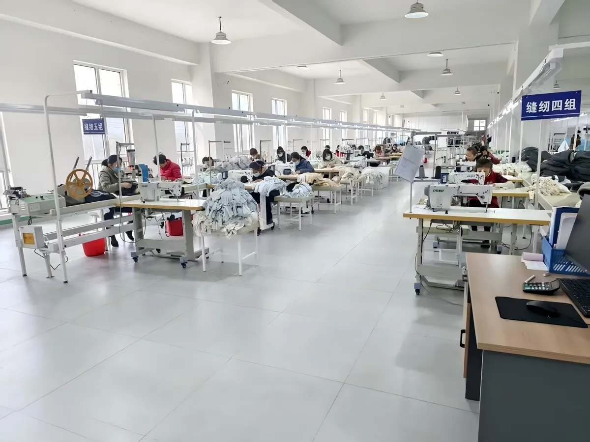 Sewing and ironing workshop of an apparel OEM manufacturer in Shandong, China